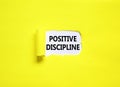 Positive discipline symbol. Concept words Positive discipline on beautiful white paper. Beautiful yellow paper background.