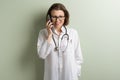 Positive doctor woman talking mobile phone Royalty Free Stock Photo