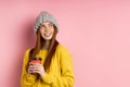 Redhead woman holding disposable cup of coffee Royalty Free Stock Photo