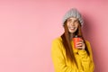 Redhead woman holding disposable cup of coffee Royalty Free Stock Photo