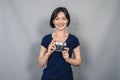 Positive emotions from photography. Woman with camera