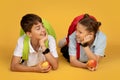 Positive european teenager pupil with backpacks and apples Royalty Free Stock Photo