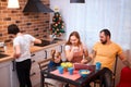 Positive family in kitchen at home Royalty Free Stock Photo