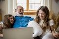 Positive family with toys and laptop stock photo