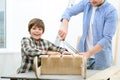 Positive father and son doing renovation Royalty Free Stock Photo