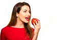 Positive Female Biting a Big Red Apple Fruit Smiling on White Ba