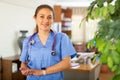 Female doctor posing in clinic