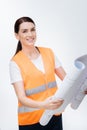 Positive female engineer rolling out blueprint Royalty Free Stock Photo