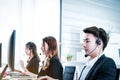 Positive Female and man Customer Services Agent With Headset Working In A Call Center Royalty Free Stock Photo