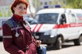 Positive female paramedic with ambulance bag Royalty Free Stock Photo