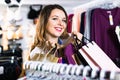 Female shopper boasting her purchases in underwear shop Royalty Free Stock Photo