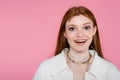 Positive freckled woman in jacket and