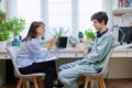 Positive friendly female psychologist talking to young guy Royalty Free Stock Photo