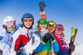 Positive friends with snowboards and skis Royalty Free Stock Photo