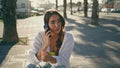 Positive girl calling phone at sunny exterior close up. Woman talking smartphone Royalty Free Stock Photo