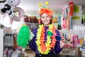 Girl in store of festival accessories Royalty Free Stock Photo