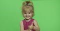 Positive girl looking to a camera in purple dress. Thumbs up. Chroma Key