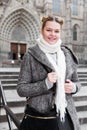 Positive girl teenager in the city in scarf Royalty Free Stock Photo