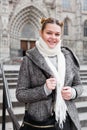 positive girl teenager in the city in scarf Royalty Free Stock Photo