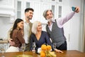 Happy family members taking picture on smartphone during birthday celebration Royalty Free Stock Photo