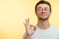 A positive guy showing the gesture of approval. unquestioning acceptance. Royalty Free Stock Photo