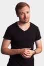 Positive handsome man in black t-shirt. Isolated