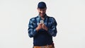 Positive handyman using smartphone isolated on Royalty Free Stock Photo