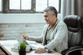 Positive happy man looking at the laptop screen Royalty Free Stock Photo