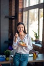 Positive happy woman having a tasty lunch