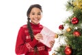 Positive holding pink present near christmas