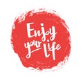 Positive inspirational handwritten phrase Enjoy your life on the red spot. Hand drawn brush lettering. Royalty Free Stock Photo