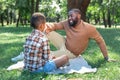 Positive joyful man speaking with his son