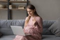 Positive late pregnant woman talking on video call Royalty Free Stock Photo