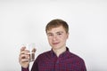 Positive looking teenager is drinking water out of a  glass Royalty Free Stock Photo