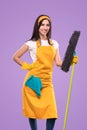 Positive maid in apron with mop Royalty Free Stock Photo