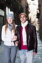 Positive male and female walking in autumn