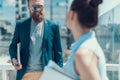 Positive male talking with lady during break