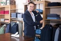 Positive man customer searching new suit Royalty Free Stock Photo