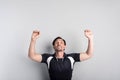 Positive man doing exercises on the horizontal bar