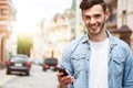 Positive man holding cell phone Royalty Free Stock Photo