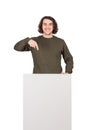 Positive man, lower body part hidden behind a blank banner for advertising and messages. Happy guy pointing his index finger to Royalty Free Stock Photo