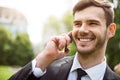 Positive man talking on cell phone Royalty Free Stock Photo