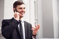 Positive man talking on cell phone Royalty Free Stock Photo