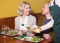 Positive mature couple having dinner at restaurant Royalty Free Stock Photo