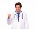 Positive medical doctor standing in white uniform