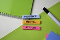 Positive Mental Attitude text on top view office desk table of Business workplace and business objects