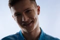 Portrait of a delighted young man smiling