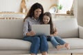 Positive mother and sweet preschool kid girl using computer Royalty Free Stock Photo