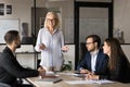 Positive motivated business leader woman holding teamwork meeting Royalty Free Stock Photo