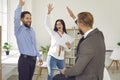 Colleagues in office who together successfully closed deal victoriously raise stack of hands. Royalty Free Stock Photo